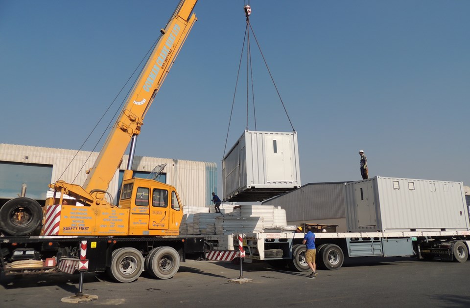 Crane lifts lowe container.JPG